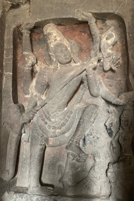Lord Shiva killing Demon of Ignorance at the Ellora caves in Maharashtra, India